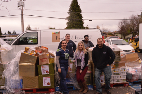 The Torklift Central team and Kent Food Bank volunteers unload food donations