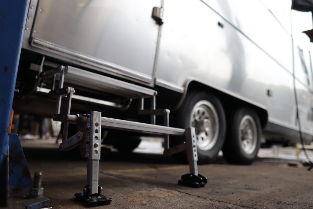 A trailer with a trailer in the background

Description automatically generated with medium confidence