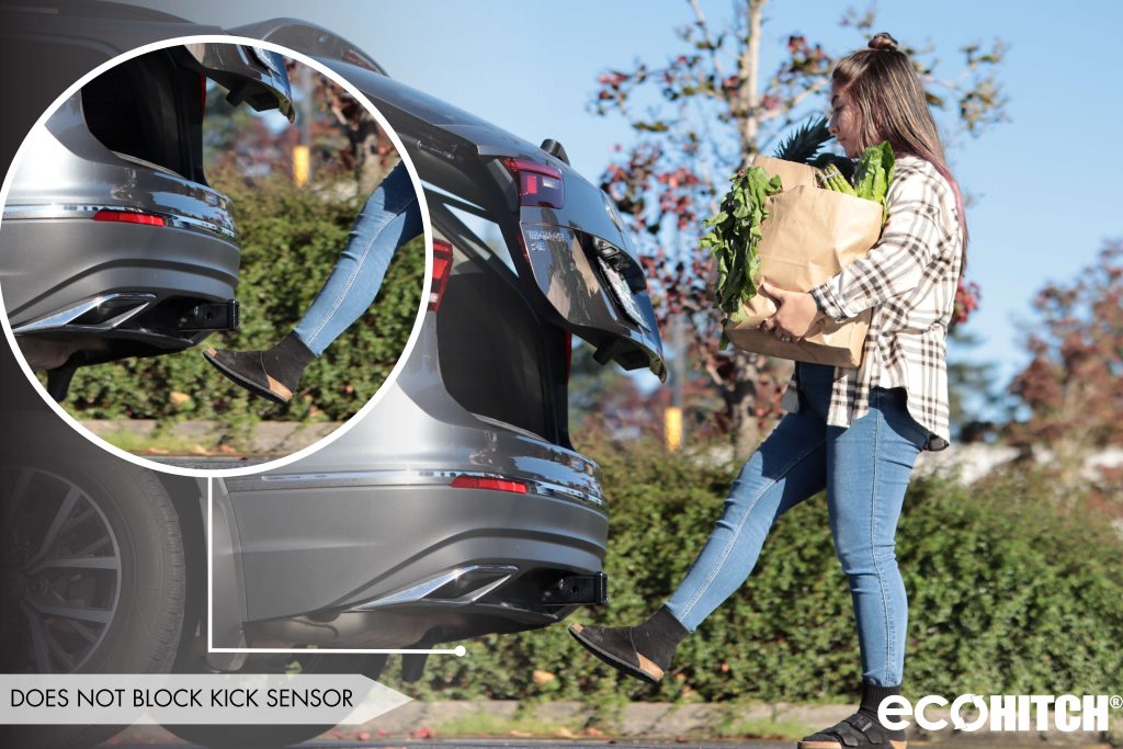 A person walking into a car
Description automatically generated