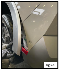 A person fixing a car

Description automatically generated