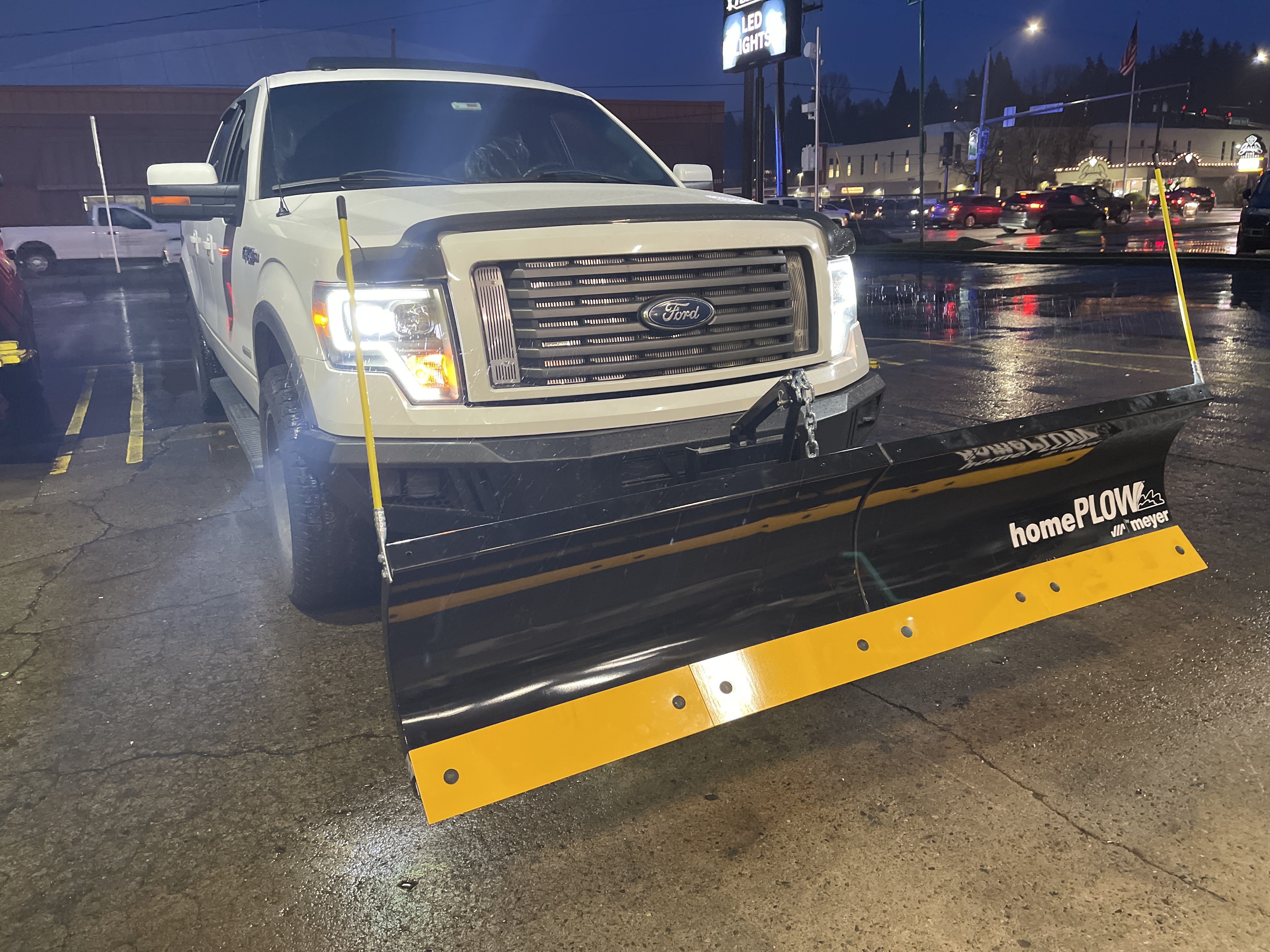 Snow plow equipped work truck at Torklift Central