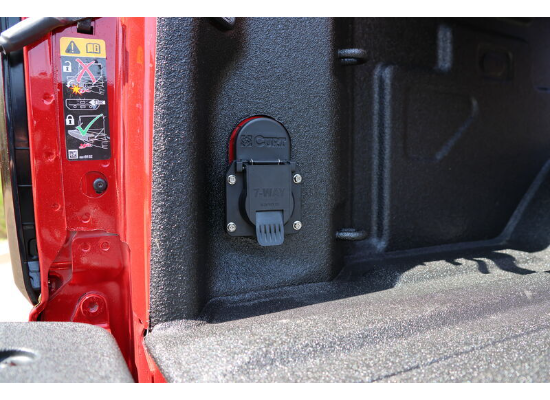 In-bed trailer wiring plug accessory