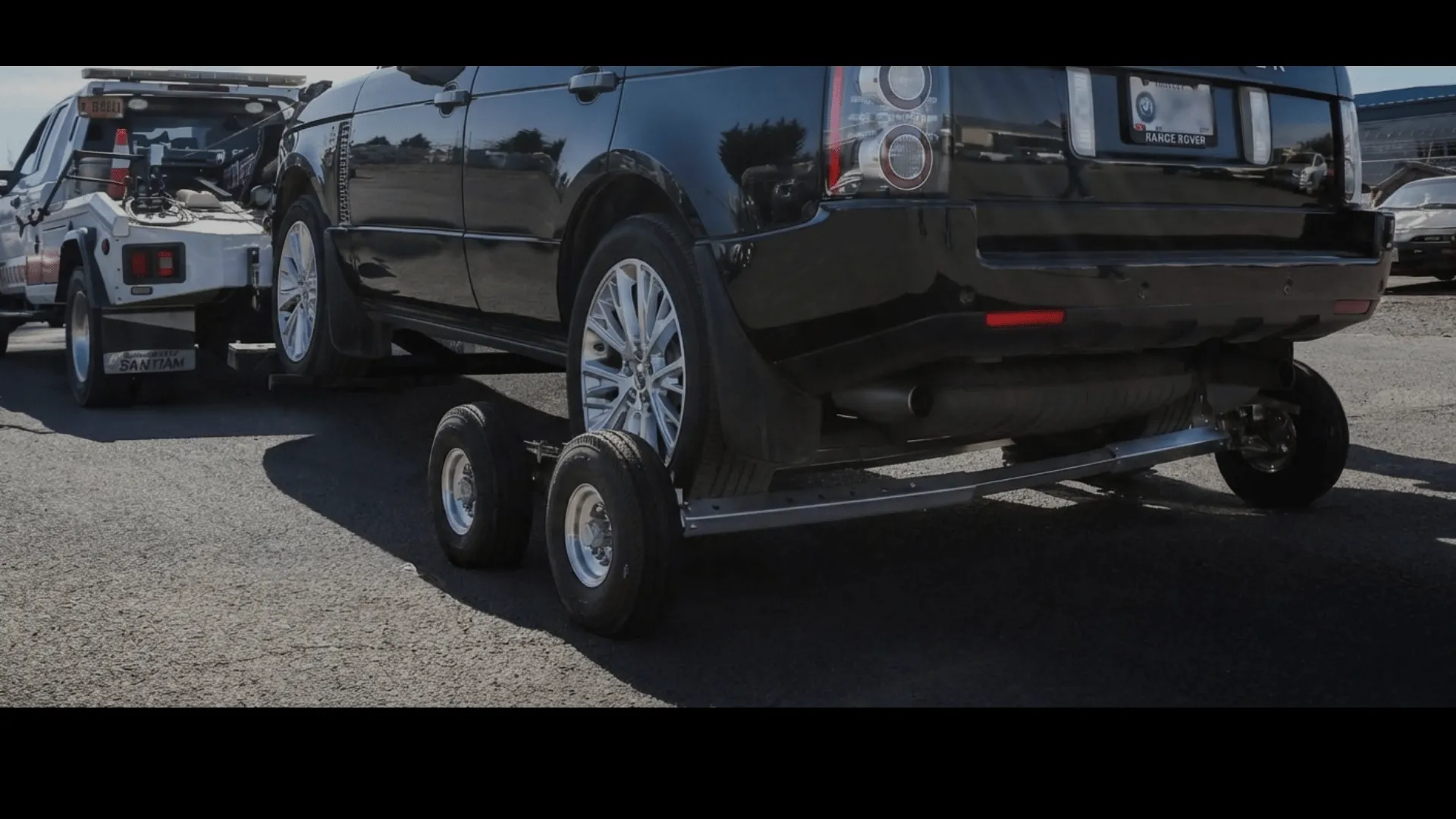 Vehicle positioned on a tow dolly for RV towing